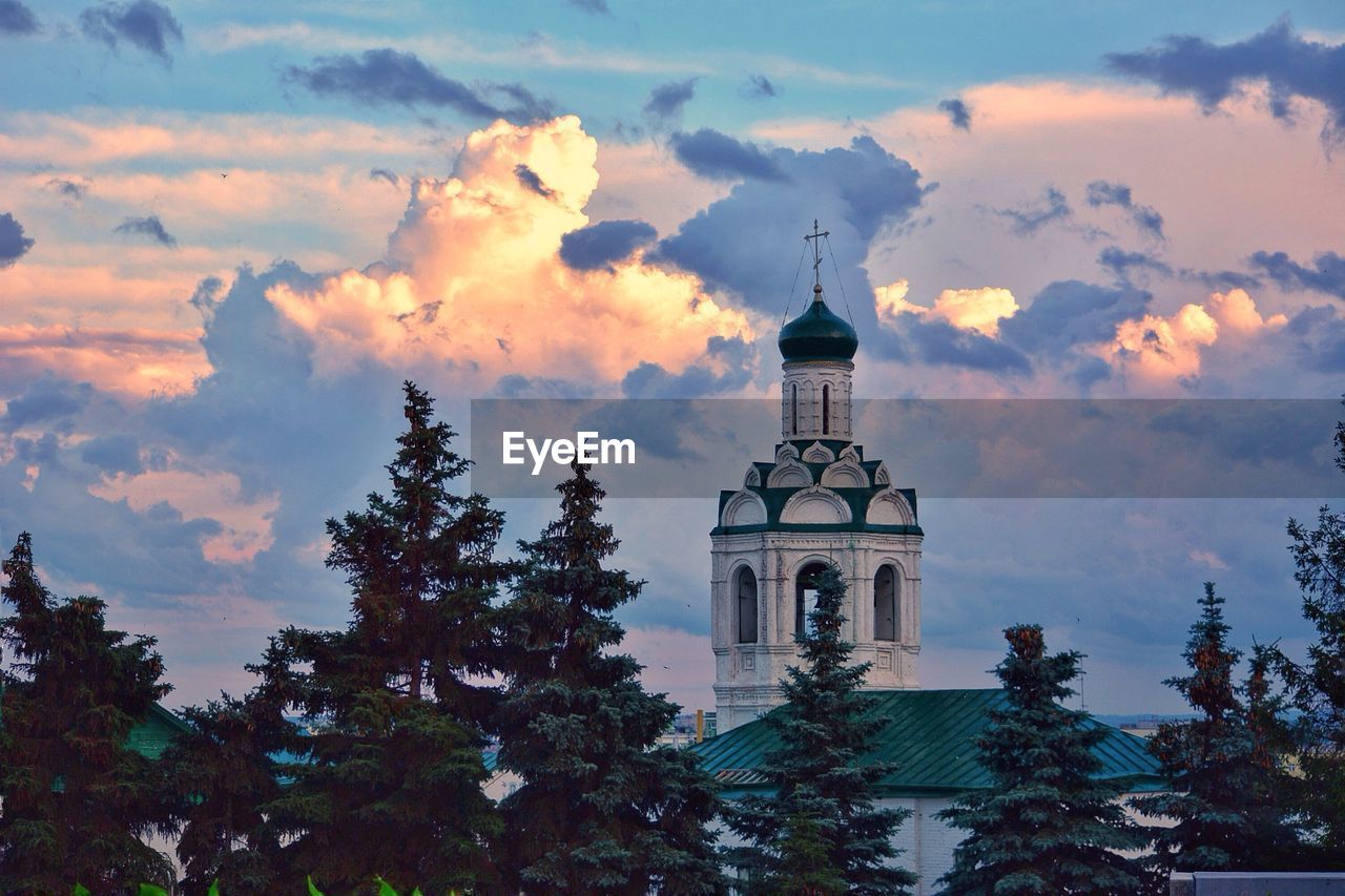 Low angle view of bell tower against sky