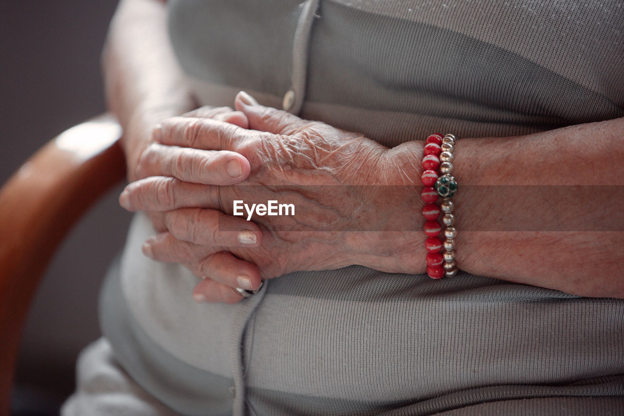 Close-up of couple holding hands