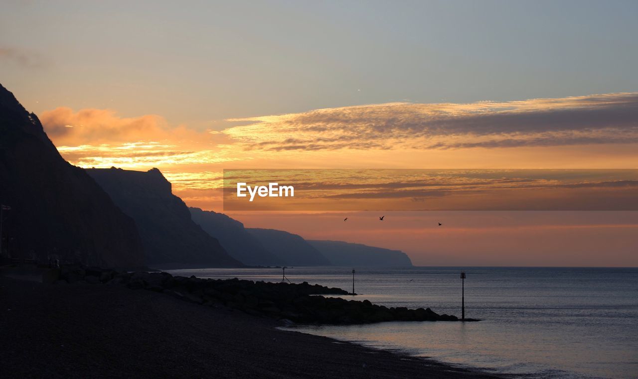 Scenic view of sea at sunset