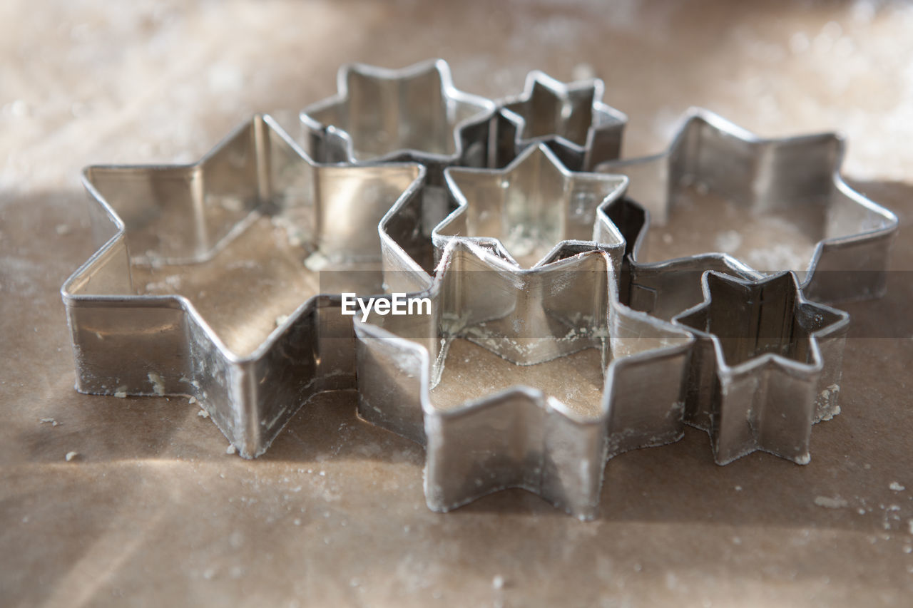 Close-up of pastry cutter on table