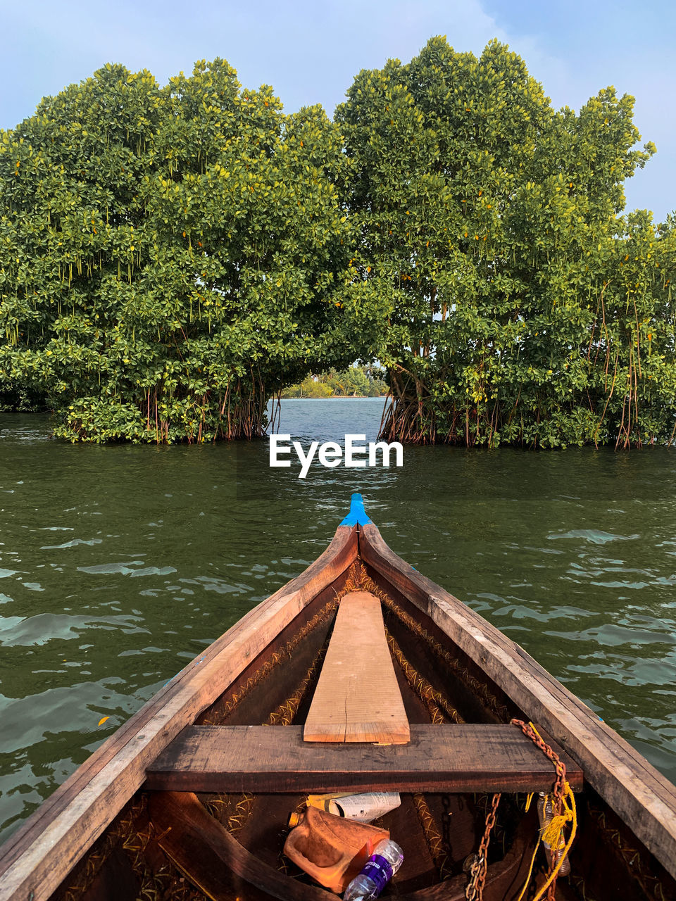 water, nautical vessel, tree, boat, plant, vehicle, nature, transportation, canoe, boating, river, watercraft, mode of transportation, travel, day, outdoors, tranquility, beauty in nature, sky, wood, scenics - nature, travel destinations, tranquil scene, vacation, trip, holiday, tourism, paddle, no people, oar, architecture, land, green, environment, rowboat, non-urban scene