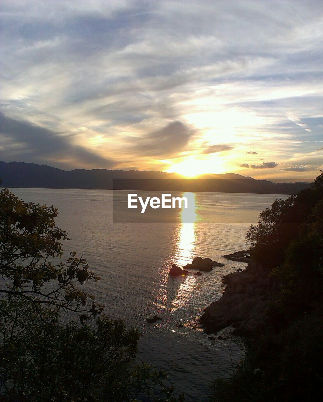 View of calm sea at sunset