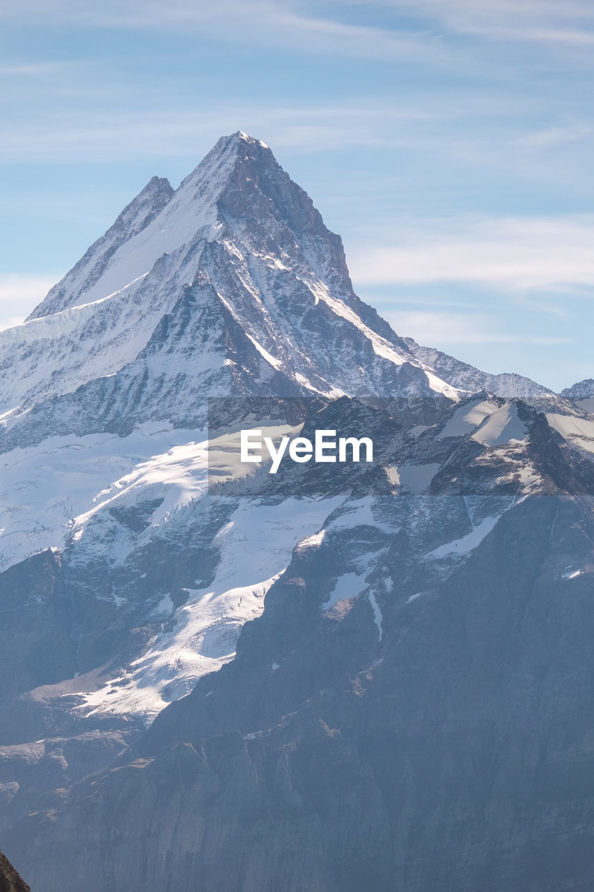 AERIAL VIEW OF SNOWCAPPED MOUNTAIN