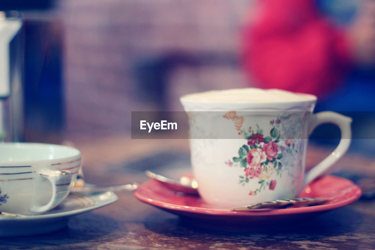 CLOSE-UP OF COFFEE ON TABLE IN CAFE