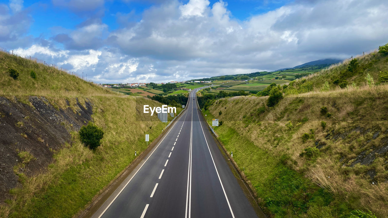 PANORAMIC VIEW OF ROAD ALONG LANDSCAPE