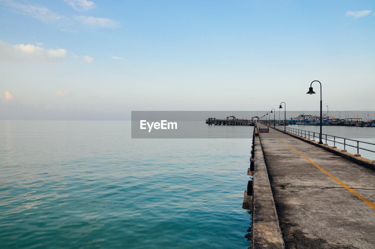 Pier over sea against sky