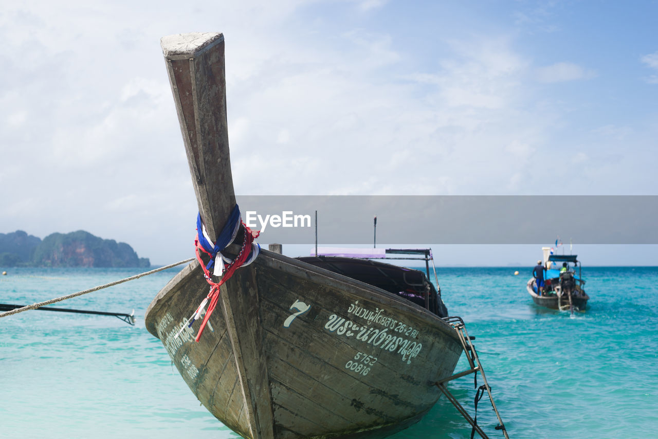 FISHING BOAT IN SEA AGAINST SKY