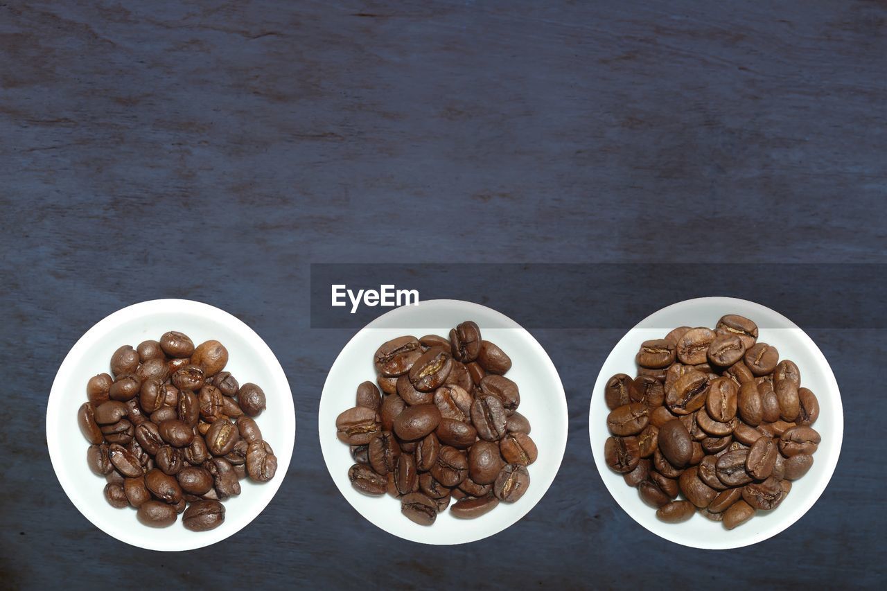 HIGH ANGLE VIEW OF COFFEE BEANS IN GLASS
