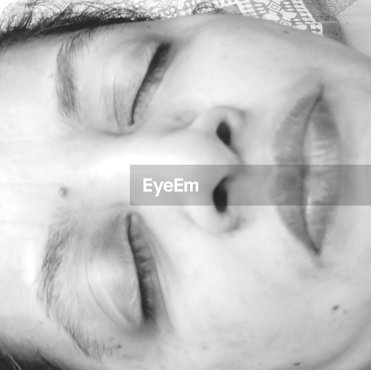 CLOSE-UP OF WOMAN SLEEPING WITH EYES CLOSED