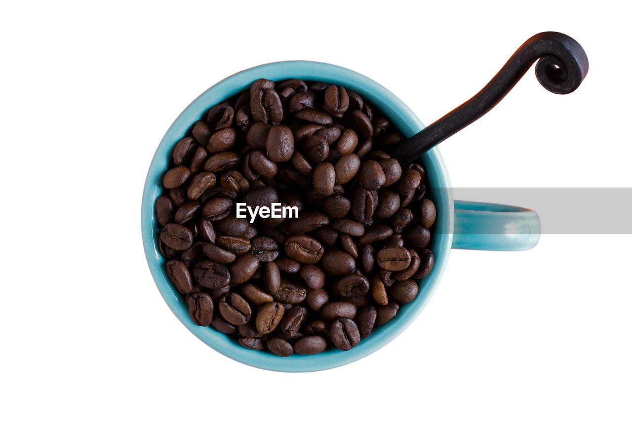 CLOSE-UP OF COFFEE BEANS IN GLASS