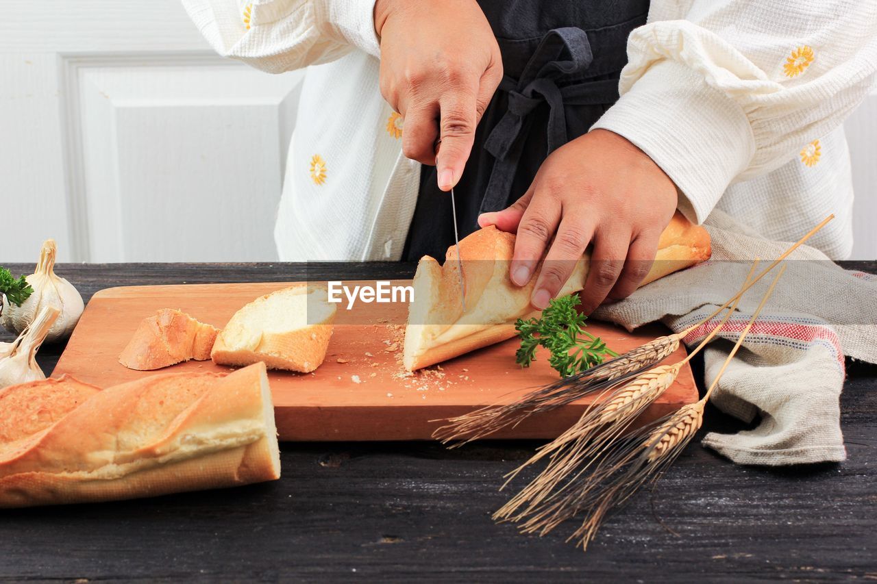 midsection of woman preparing food