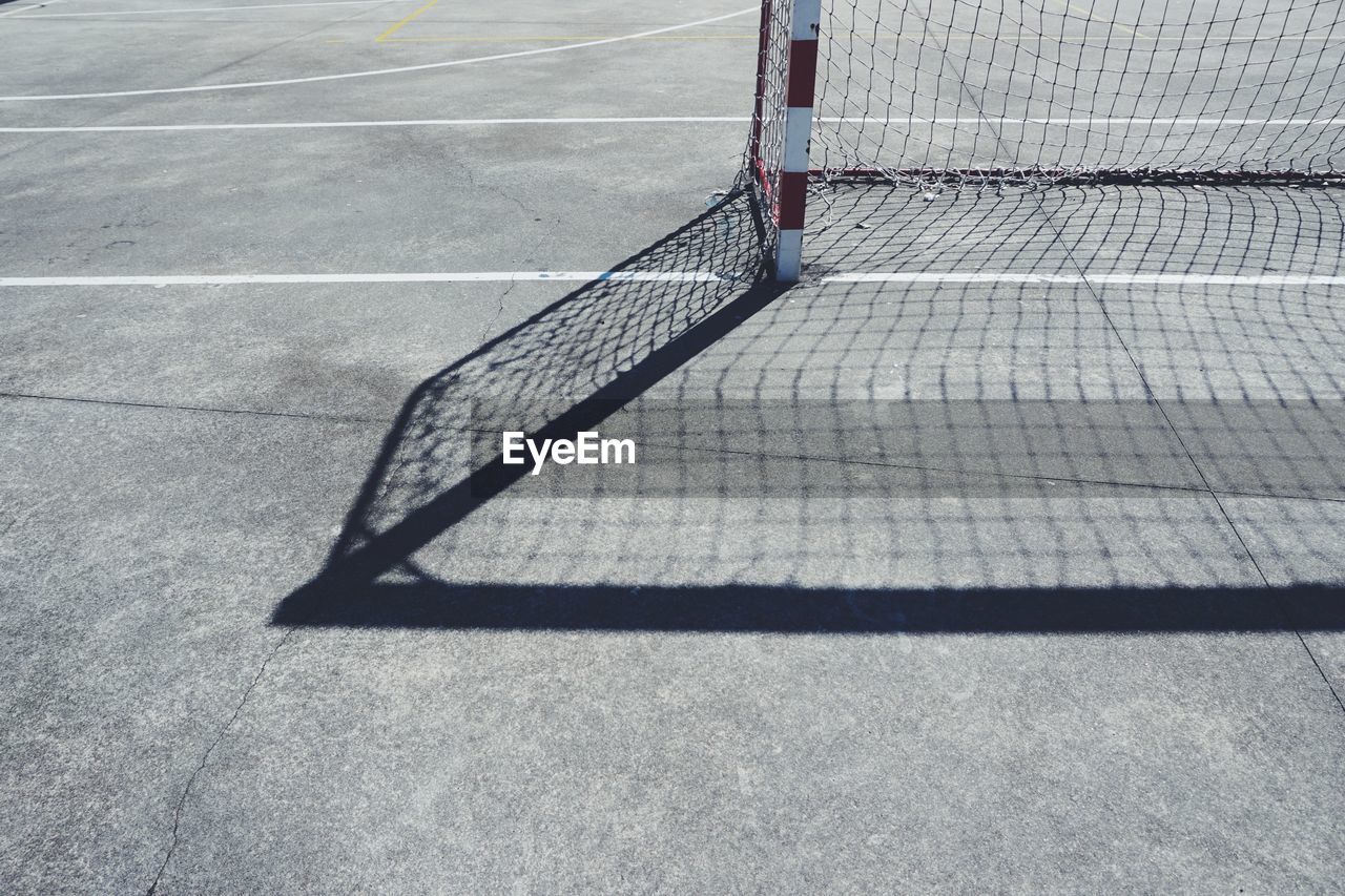 High angle view of broken net on road