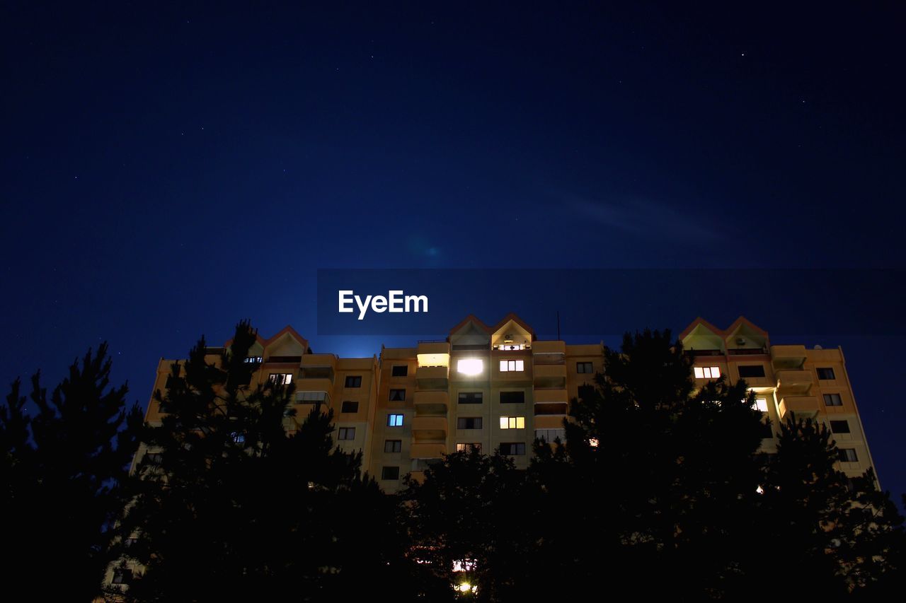 Low angle view of building against sky at night