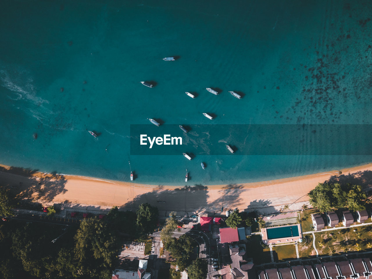 Boats docked by the beach on pangkor island