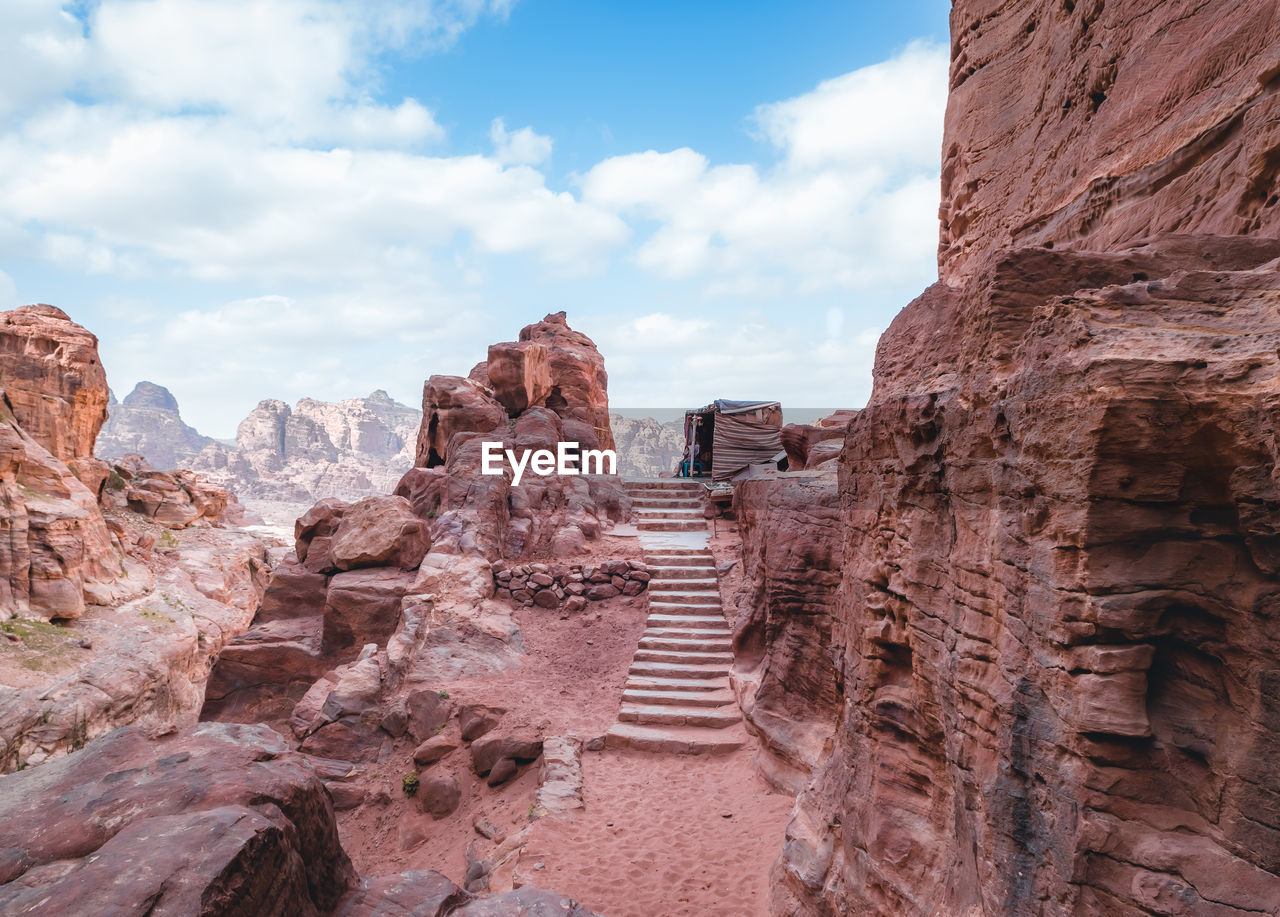 Low angle view of rock formations against sky