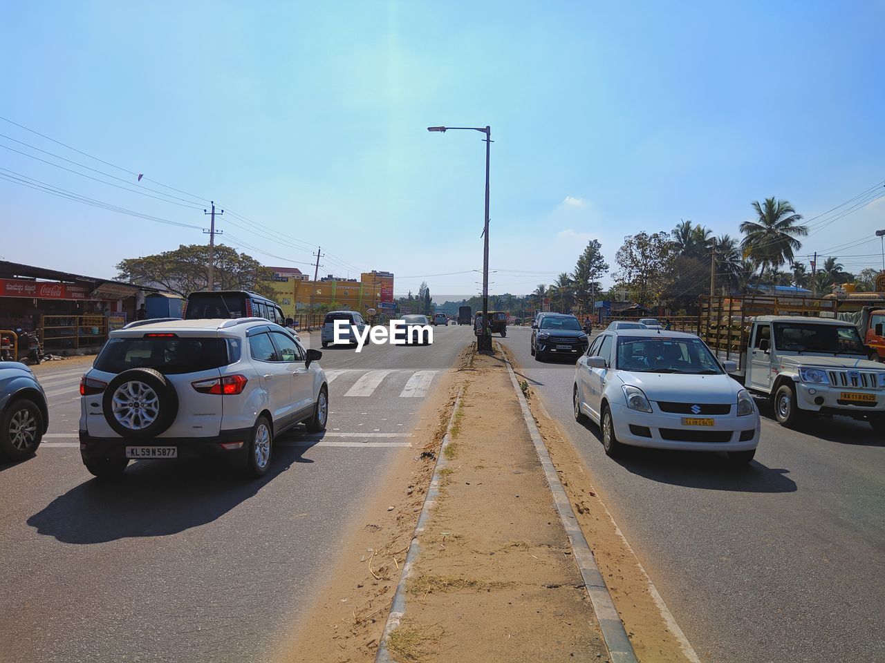 CARS PARKED ON ROAD IN CITY