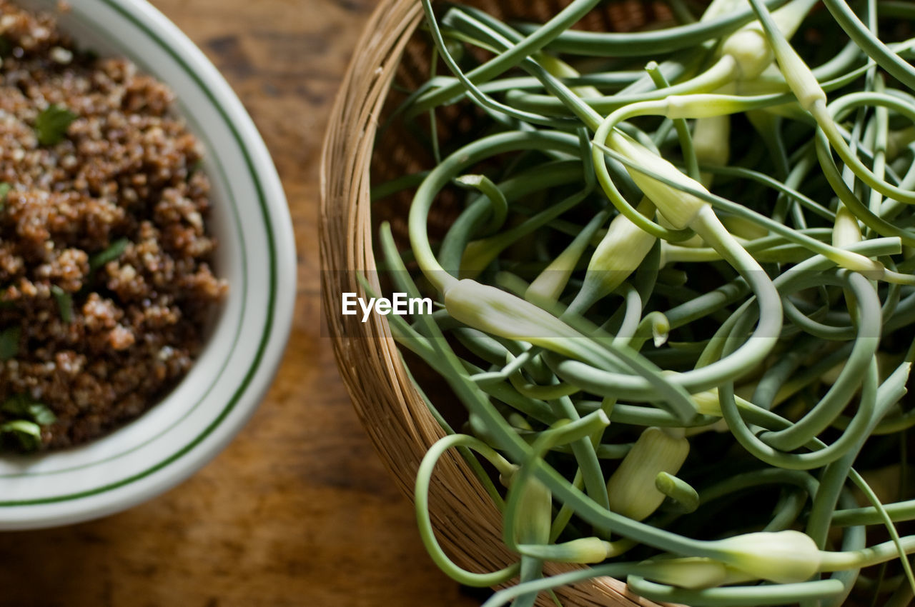 High angle view of chive buds and food on table