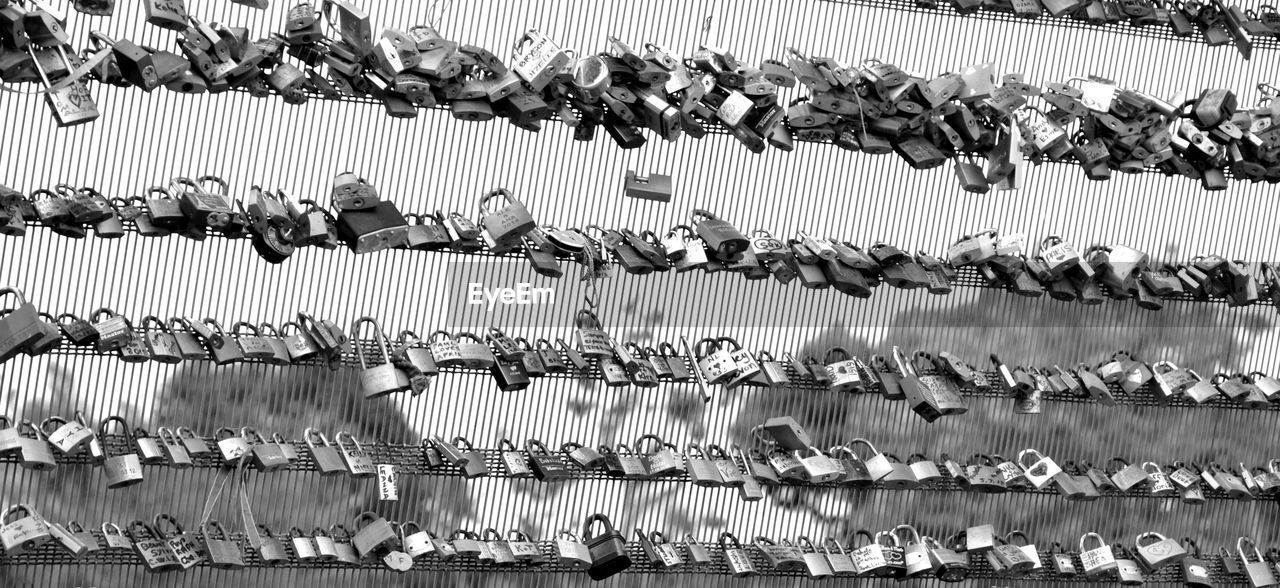 Full frame shot of lockets on wires against sky
