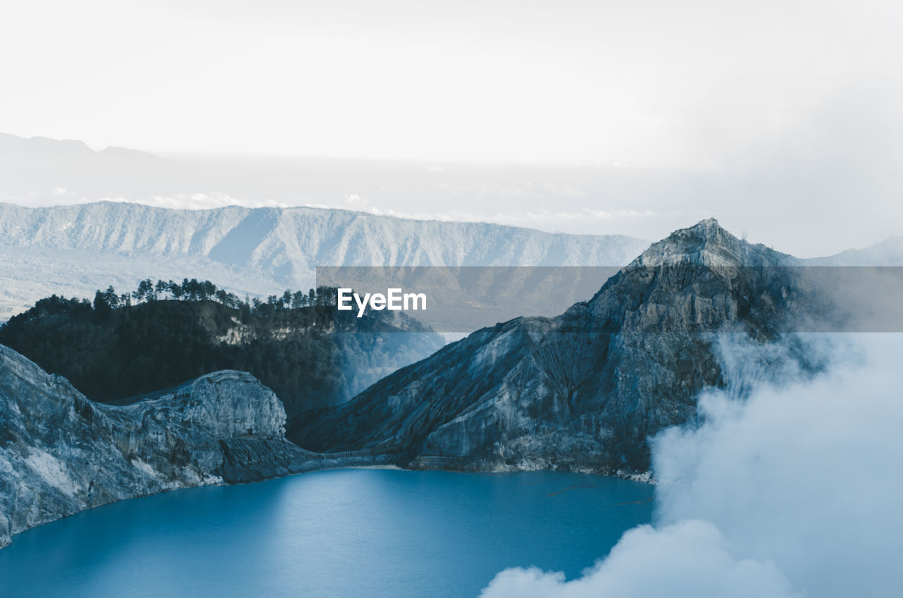 Scenic view of mountains against sky during winter