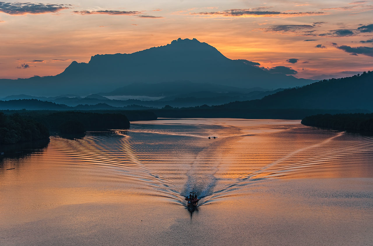 Scenic view of mountains against sky during sunset