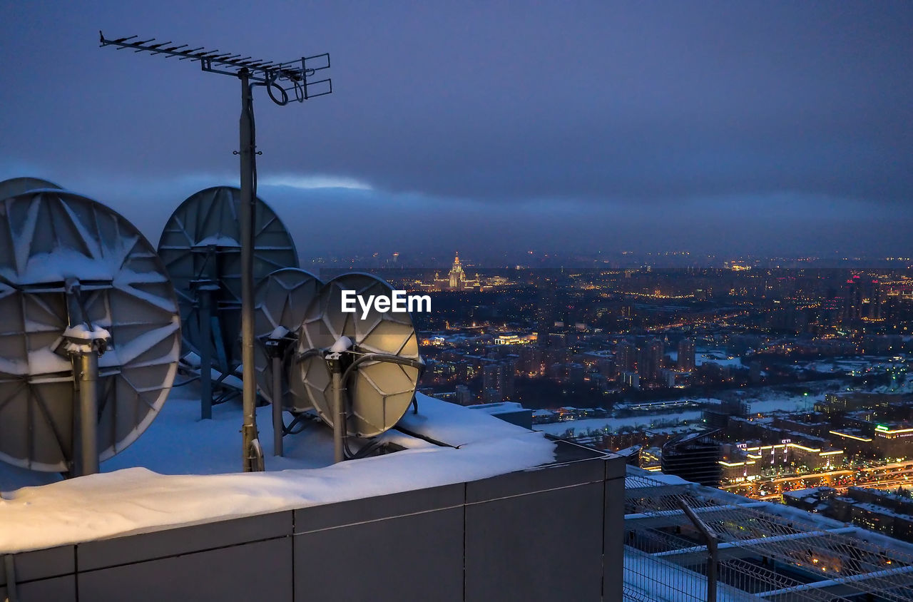 High angle view of illuminated city at night during winter