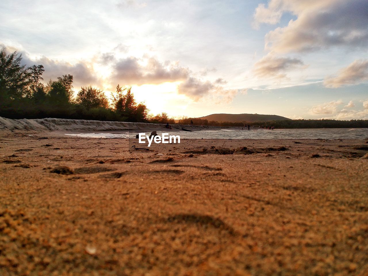 SCENIC VIEW OF BEACH DURING SUNSET