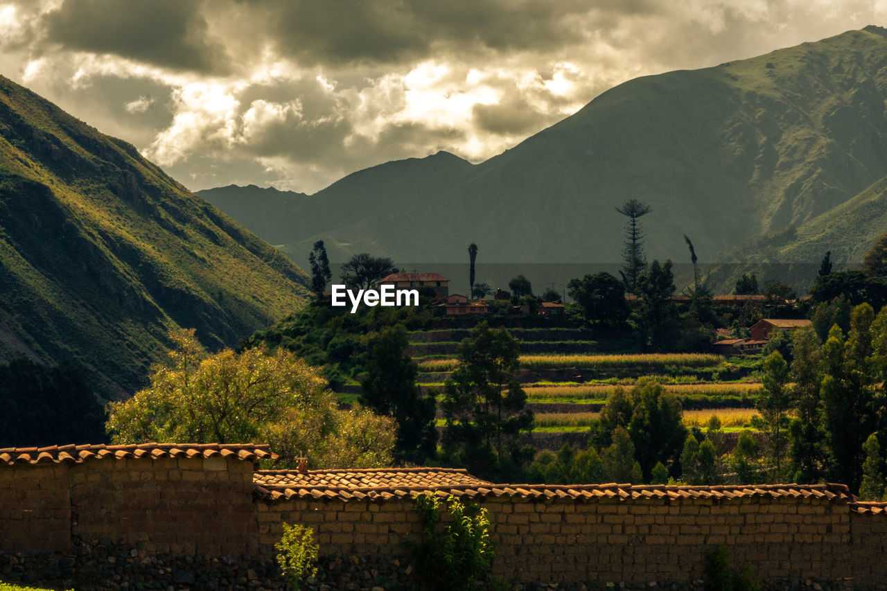 Sacred valley of the incas - scenic view of trees and mountains against sky