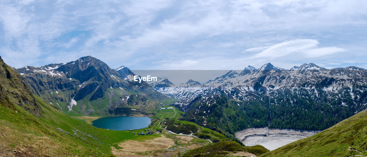 Panoramic view of snowcapped mountains against sky