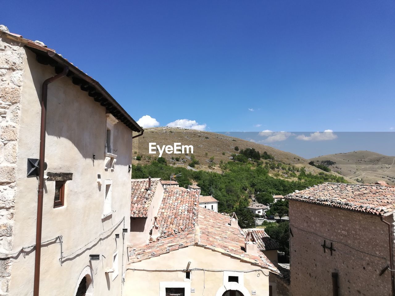 BUILDINGS AGAINST BLUE SKY