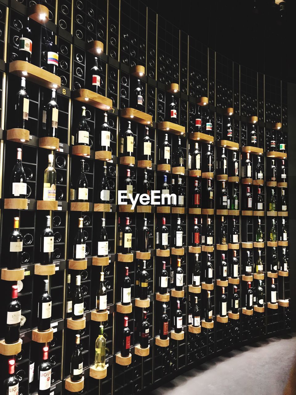 Wine bottles arranged on shelves