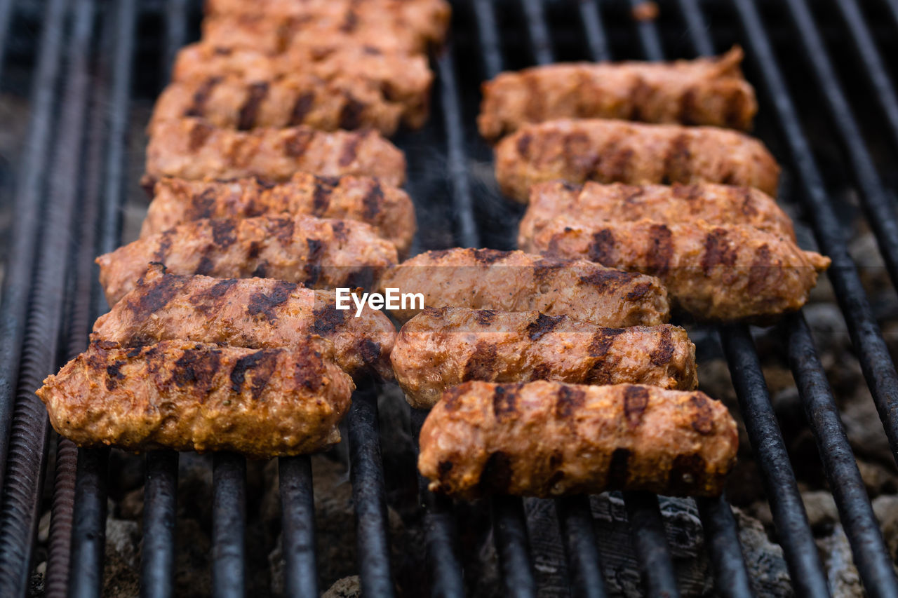 close-up of meat cooking on barbecue grill
