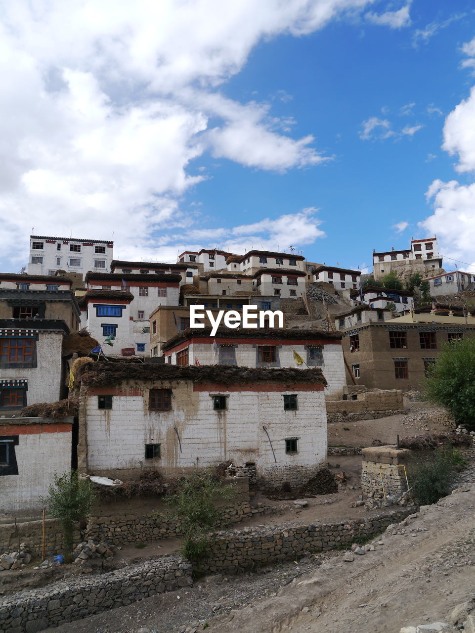 Houses with cloudy sky in background