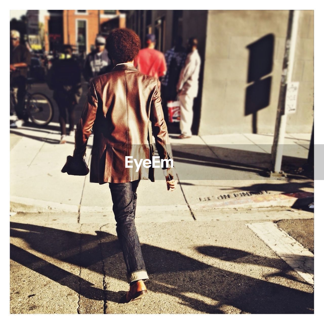 Rear view of man walking on street