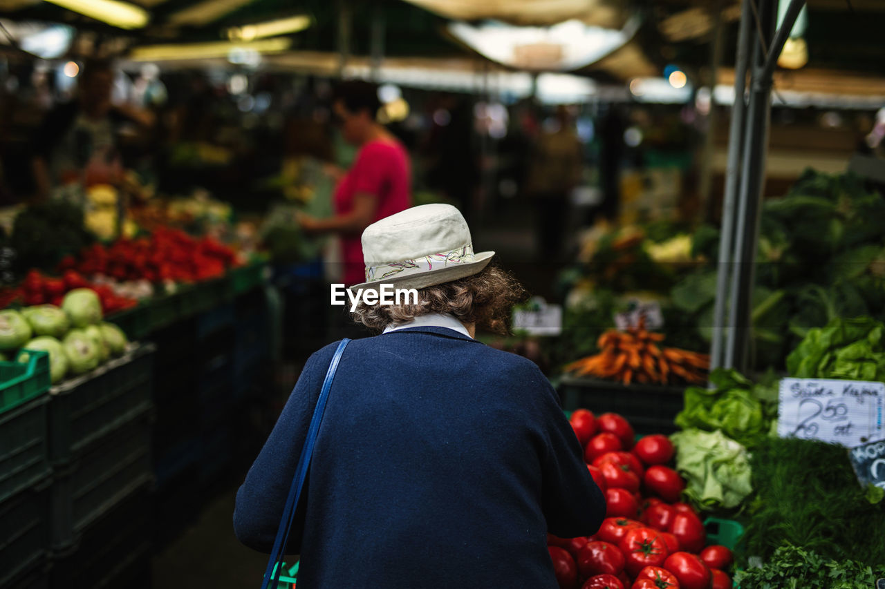 Rear view of woman at market