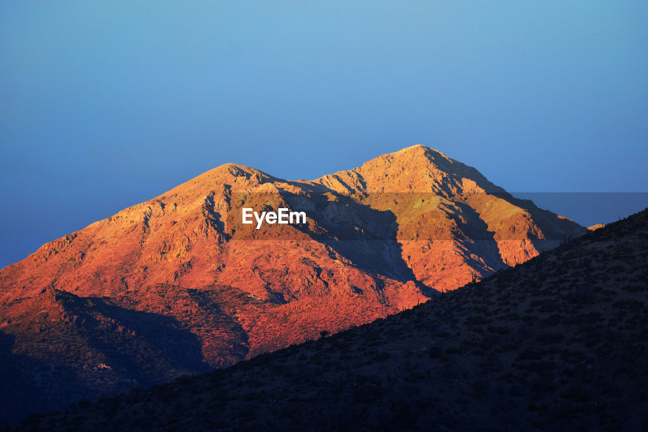 Scenic view of mountains against clear sky