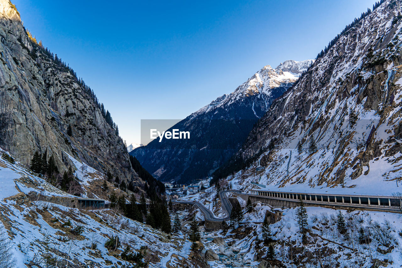 scenic view of snowcapped mountains against clear sky