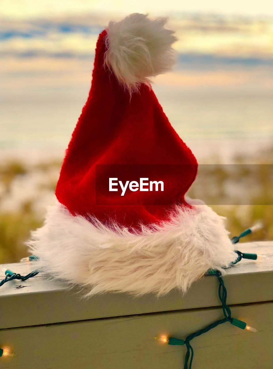 Close-up of santa hat on retaining wall