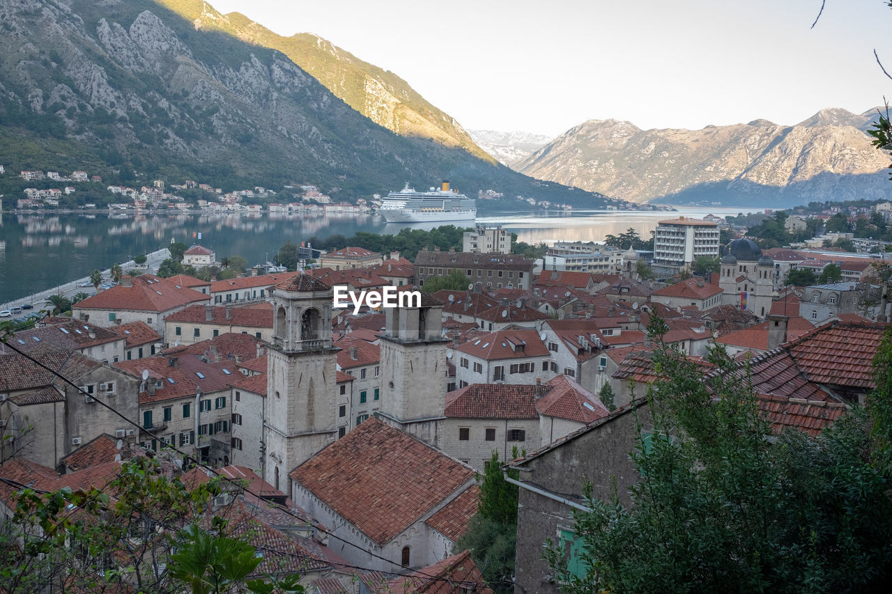 High angle view of townscape and mountains against sky