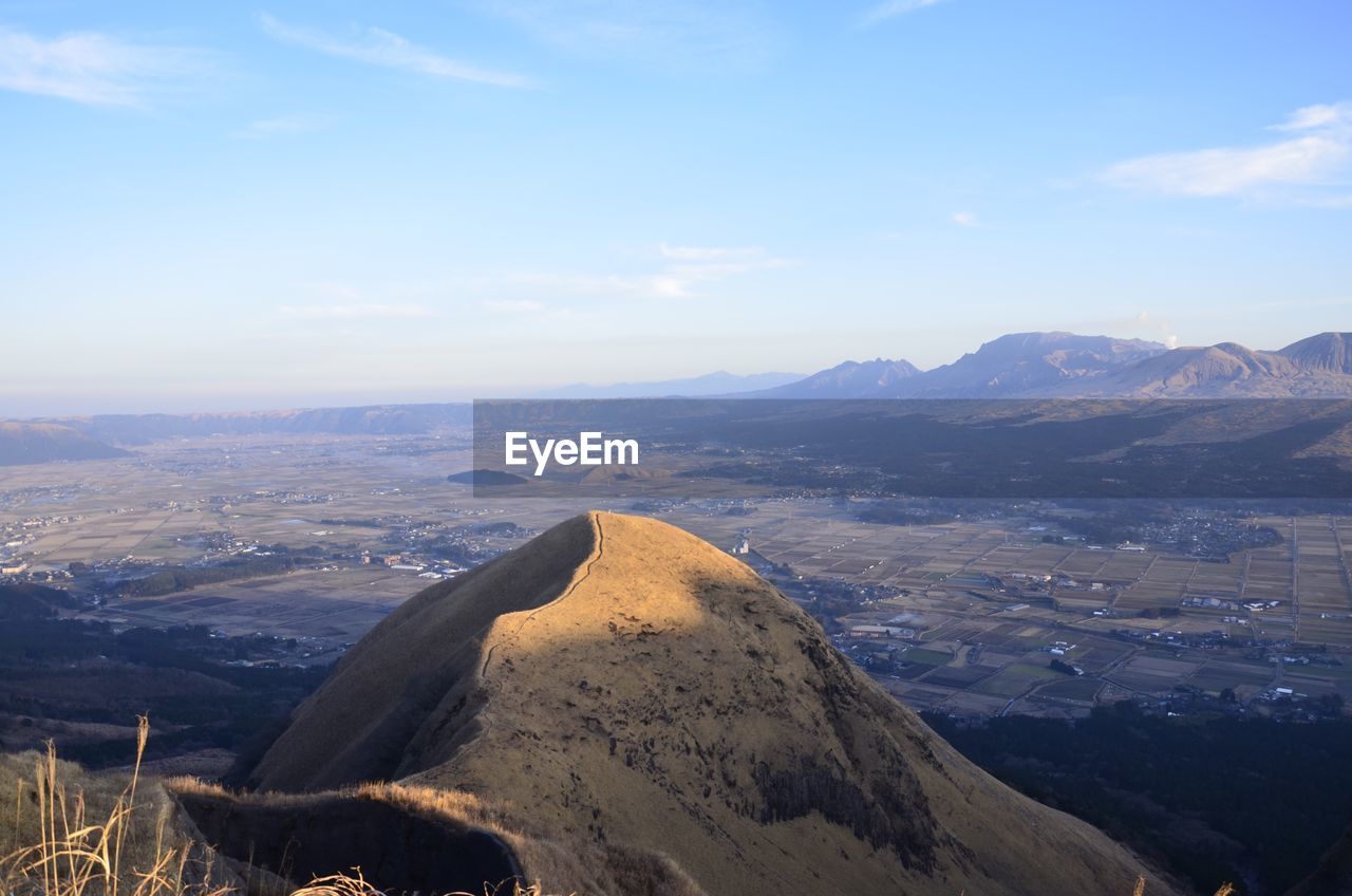 Idyllic shot of landscape against sky seen from mount aso