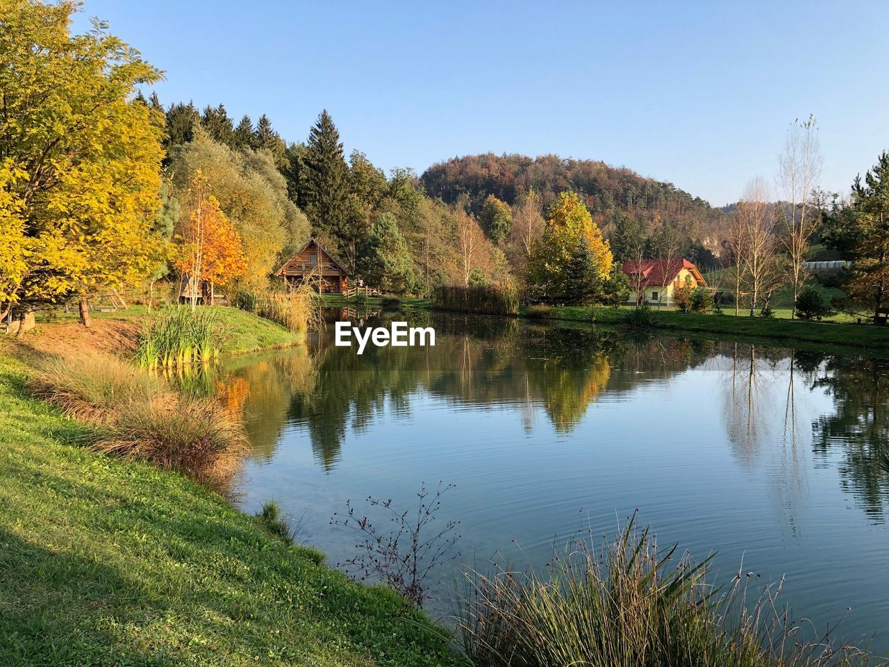 Scenic view of lake against sky during autumn