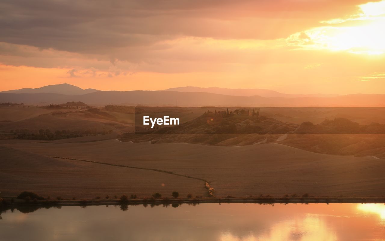 Scenic view of mountains against sky during sunset