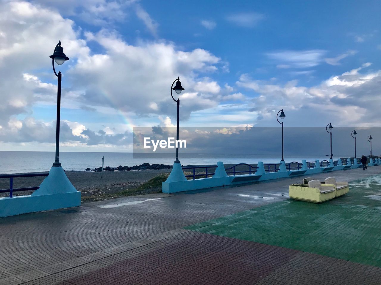 STREET AMIDST SEA AGAINST SKY