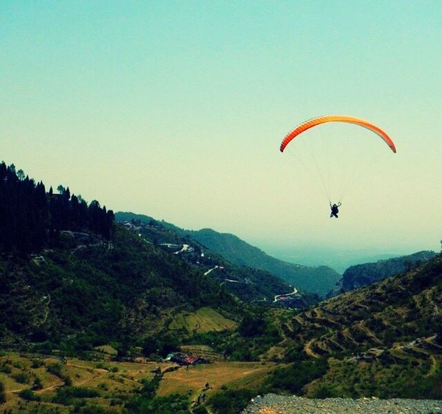 HOT AIR BALLOONS FLYING OVER MOUNTAIN