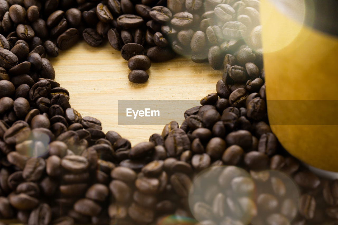 HIGH ANGLE VIEW OF COFFEE BEANS IN GLASS