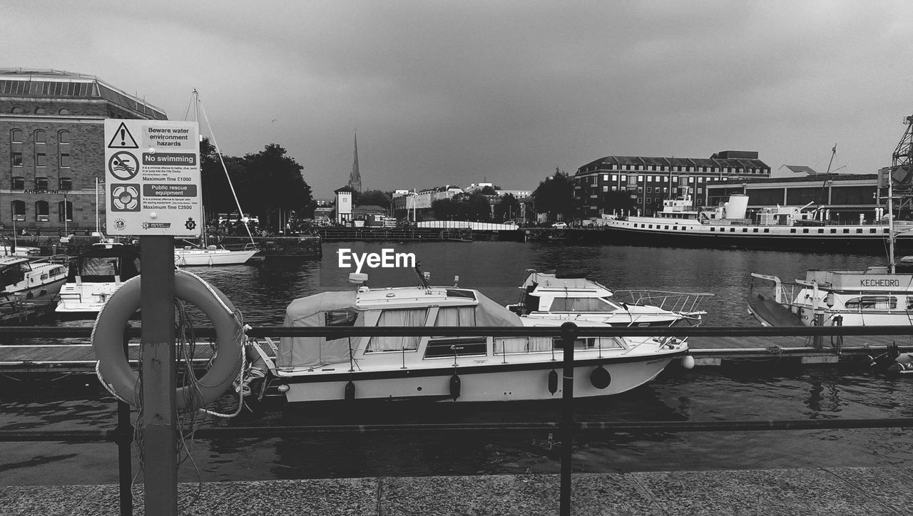 Boats moored in river