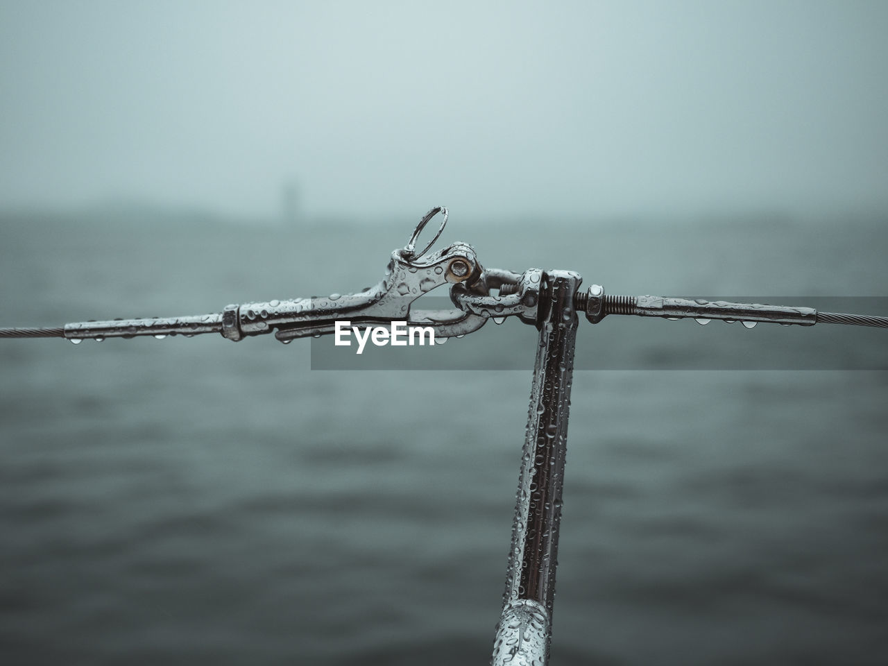 Closeup of a yacht mechanical structure in the rain.