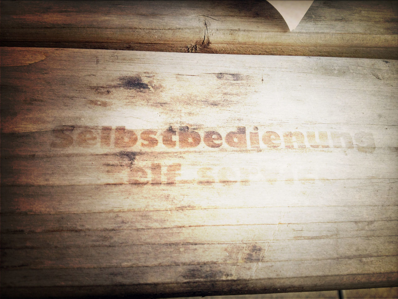 Sign on wooden plank