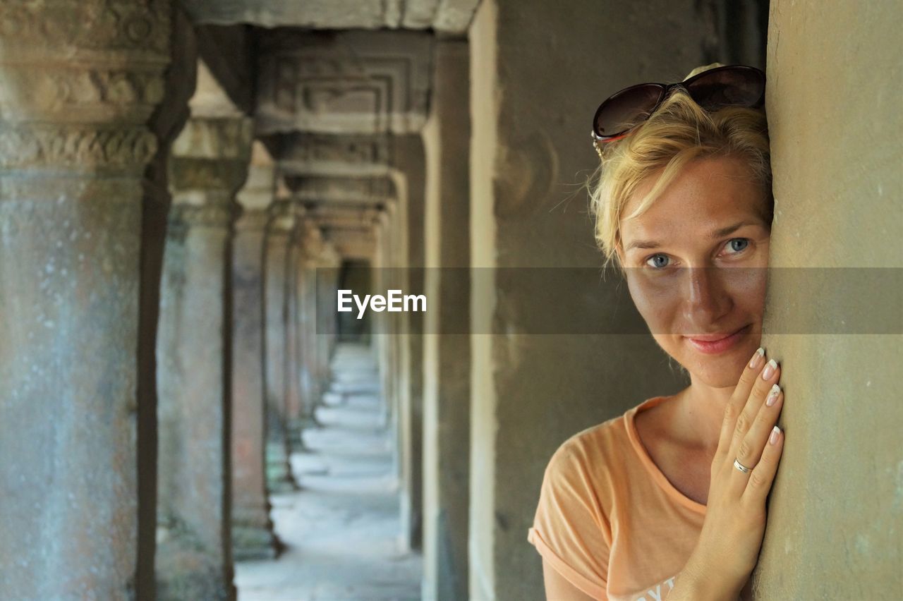 Portrait of smiling woman at temple