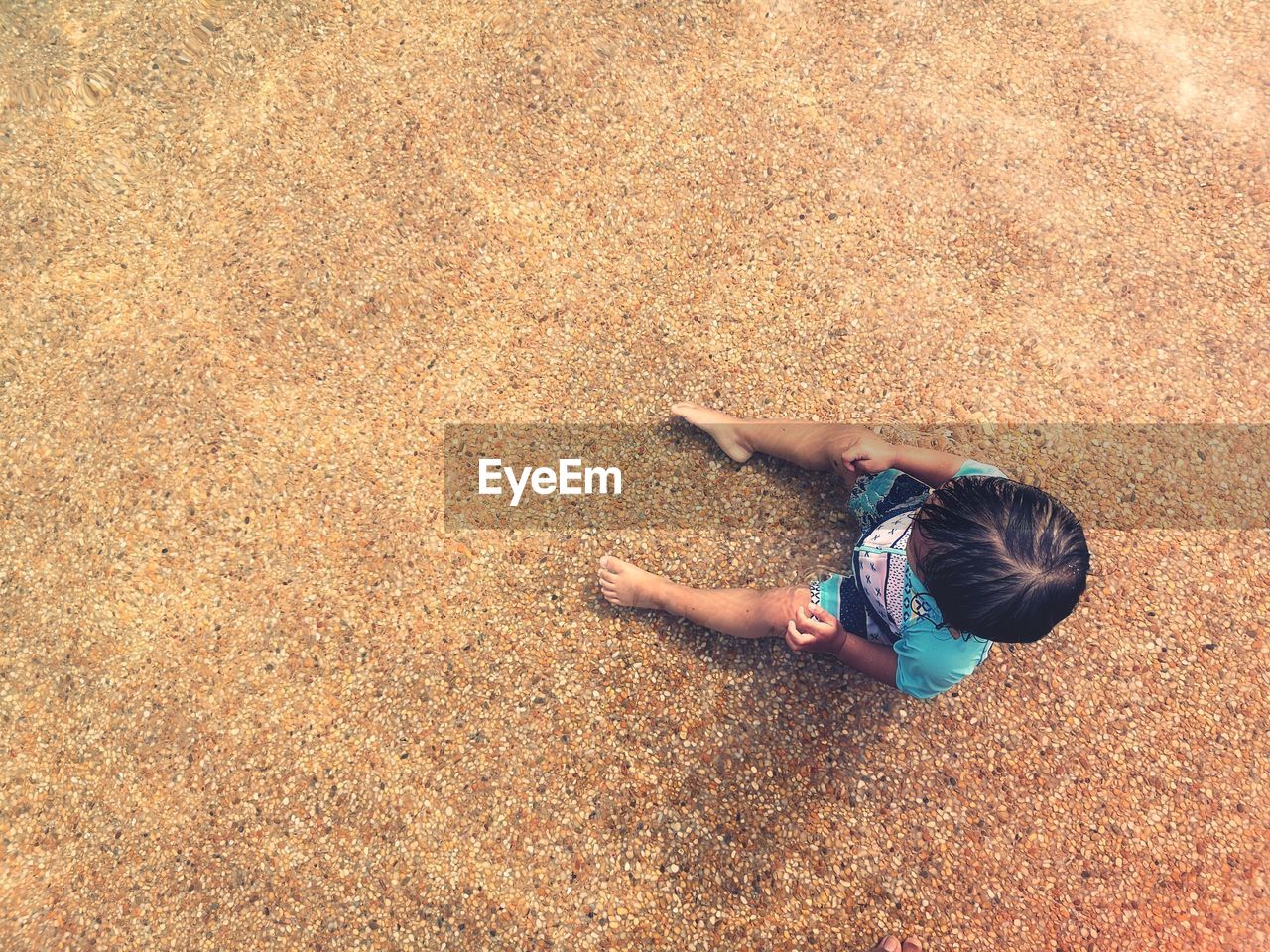 High angle view of people on sand at beach