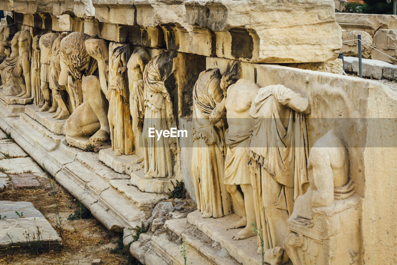 Sculptures on wall at theatre of dionysus